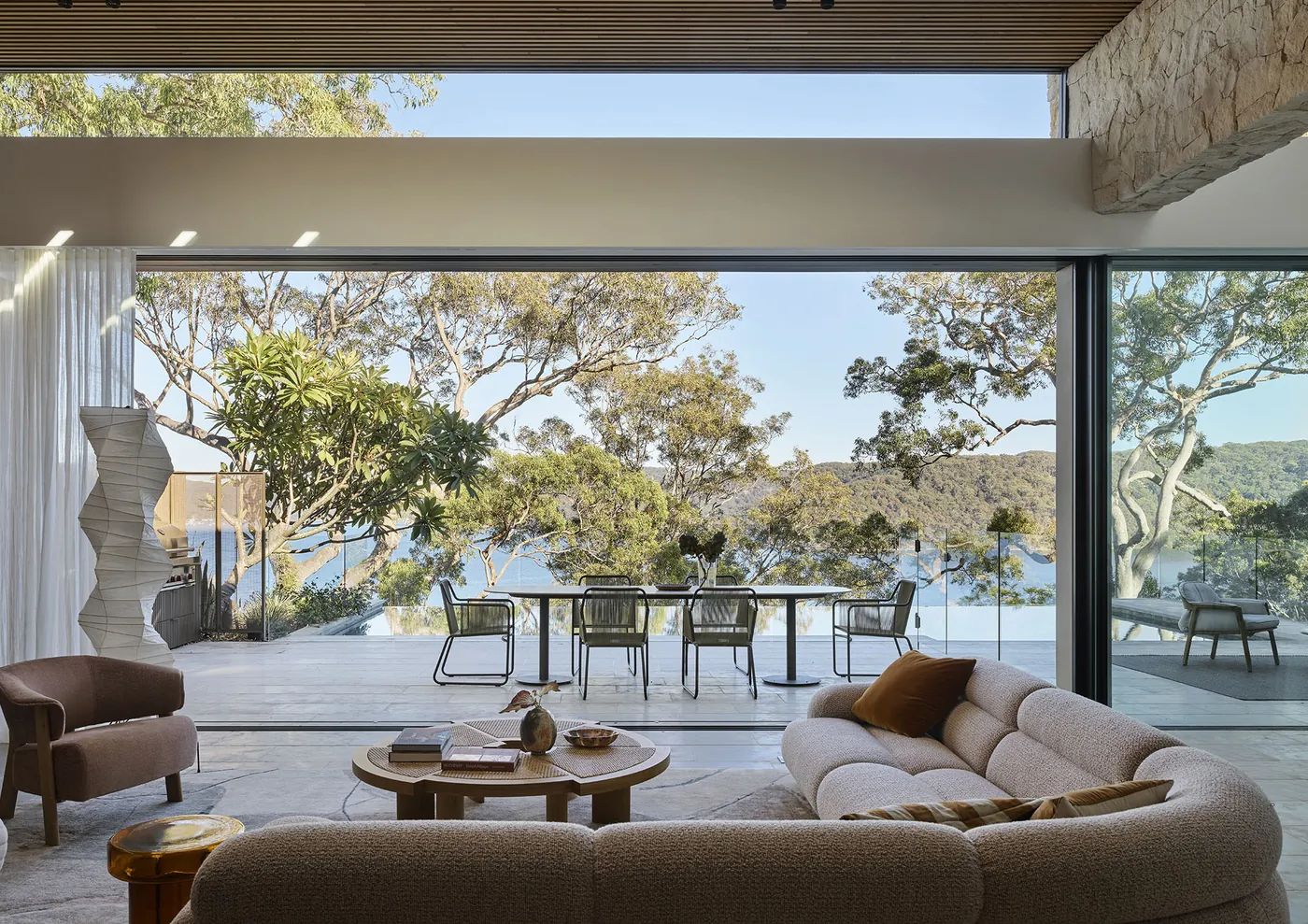 Riverview House, Avalon: living room opening to a terrace above Pittwater